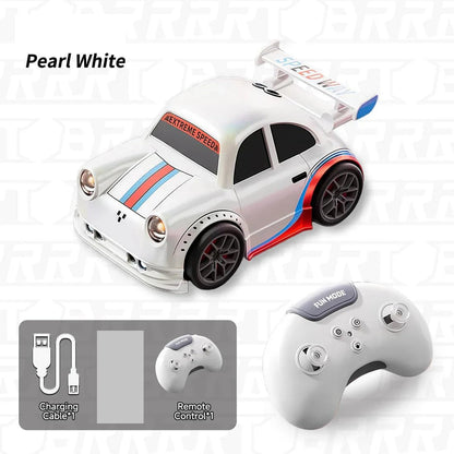 Pearl white RC car with racing decals and remote control on a light gray background