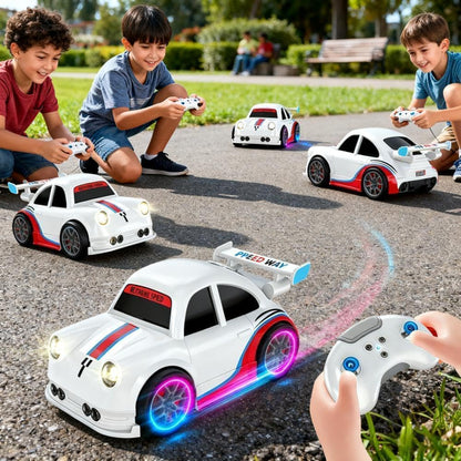 Children playing with remote control cars on a paved surface.
