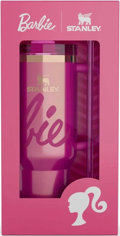 Pink tumbler with 'Stanley' branding in a box, featuring Barbie logo.