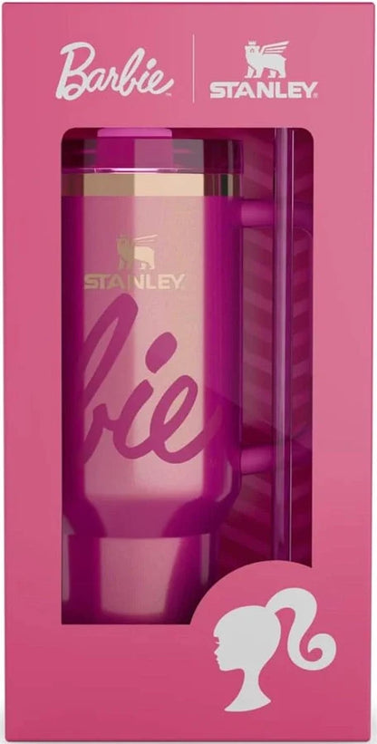 Pink tumbler with 'Stanley' branding in a box, featuring Barbie logo.